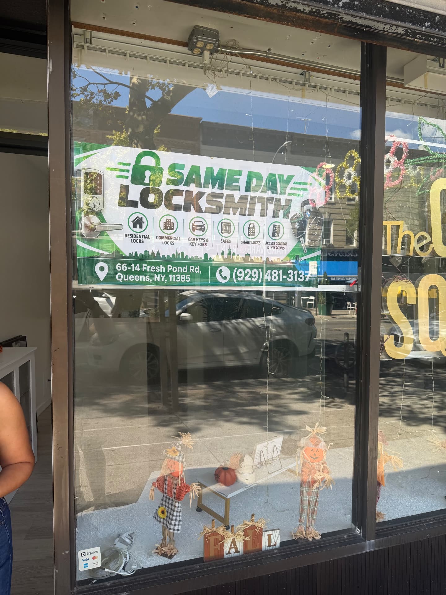 Same Day Locksmith storefront sign at 66-14 Fresh Pond Rd, Queens NY 11385